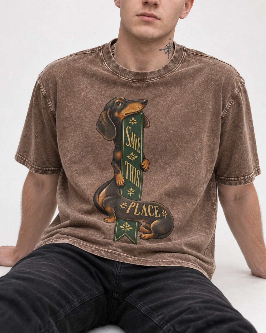 Save This Place Dachshund Washed Tee in Coffee, worn by a seated model