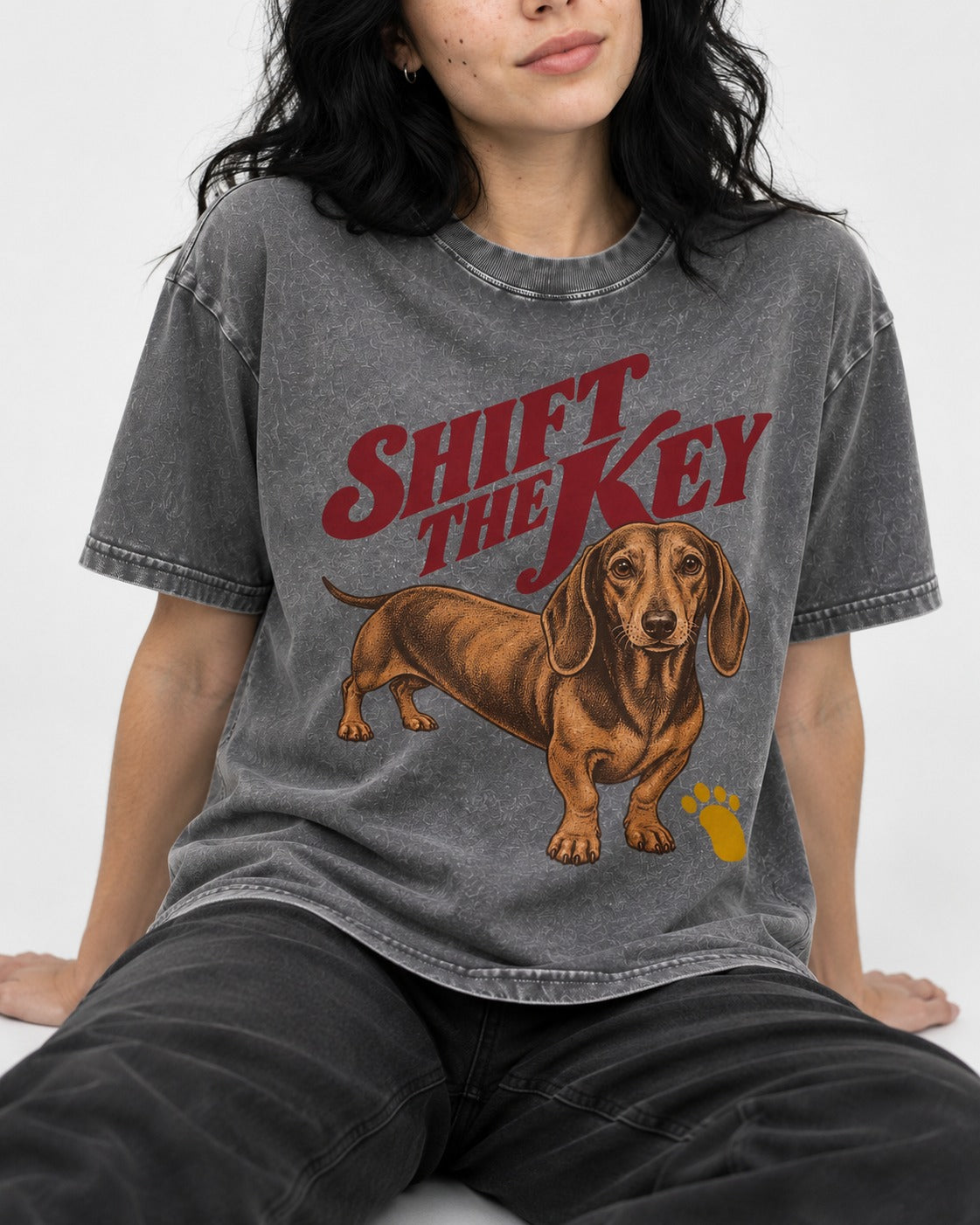 Dachshund Shift The Key Pawprint Graphic Washed Tee in Gray, worn by a seated model
