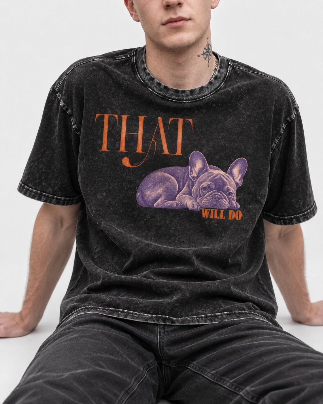 Frenchie That Will Do Resting Graphic Washed Tee in Black, worn by a seated model