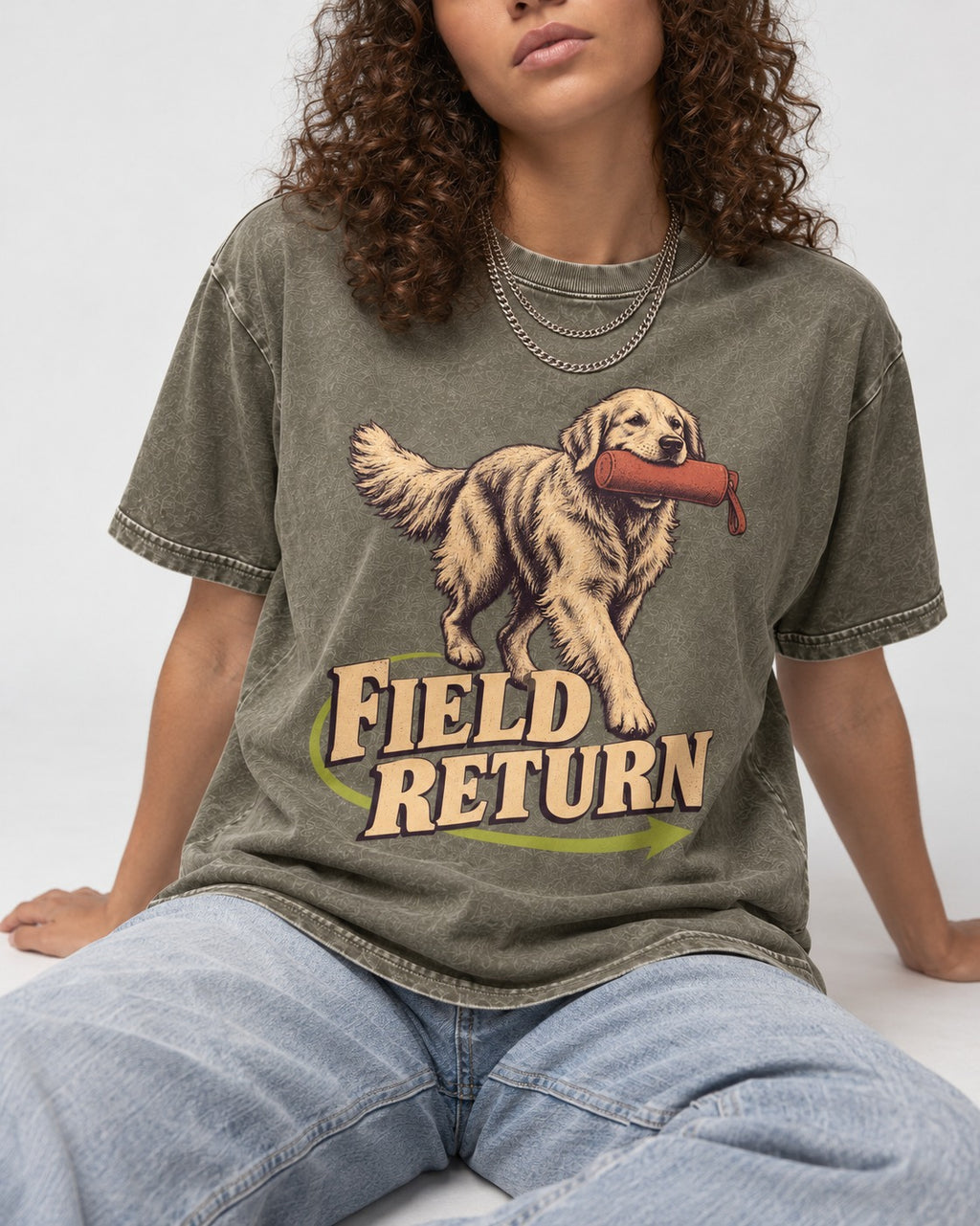 Golden Retriever Field Return Training Dummy Graphic Washed Tee in Army Green, worn by a seated model