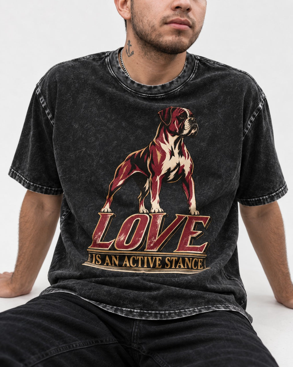 Love Is an Active Stance Boxer Pedestal Graphic Washed Tee in Black, worn by a seated model