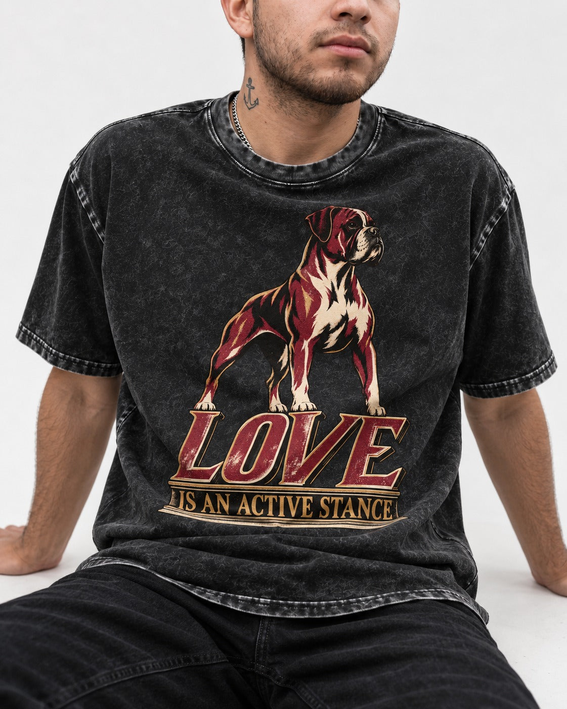 Love Is an Active Stance Boxer Pedestal Graphic Washed Tee in Black, worn by a seated model