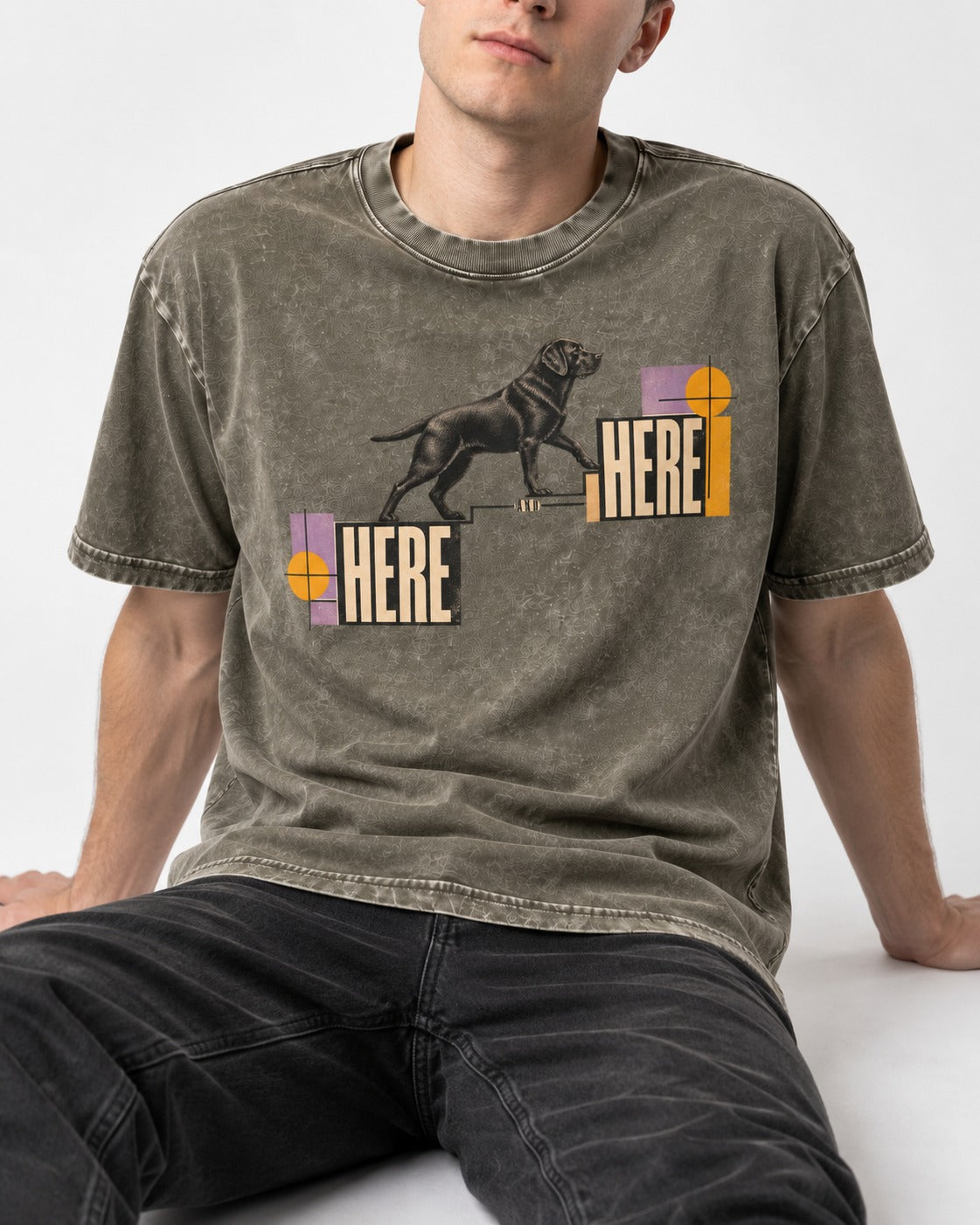 Here and Here Stepping Labrador Retriever Graphic Washed Tee in Army Green, worn by a seated model