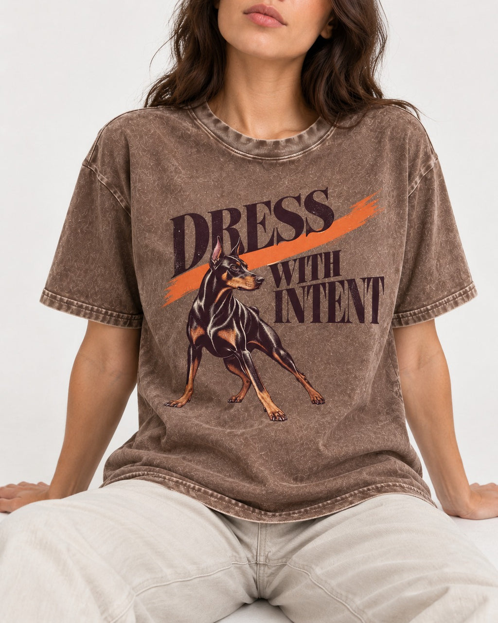 Doberman Dress with Intent Washed Tee in Coffee, worn by a seated model