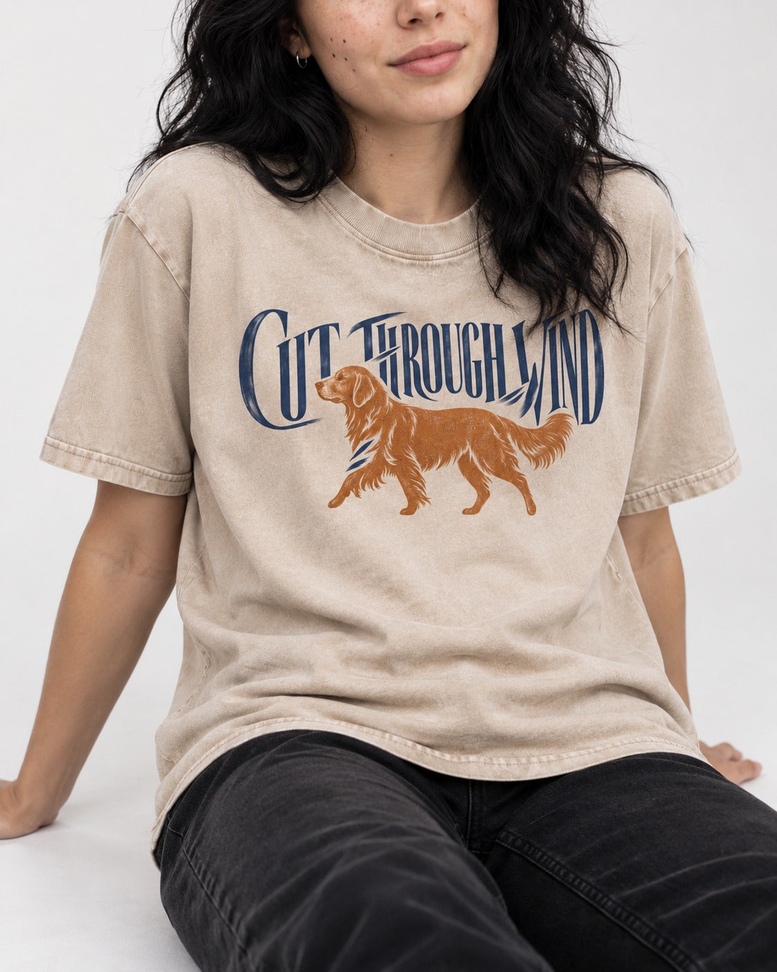 Golden Retriever Cut Through Land Washed Tee in Apricot, worn by a seated model