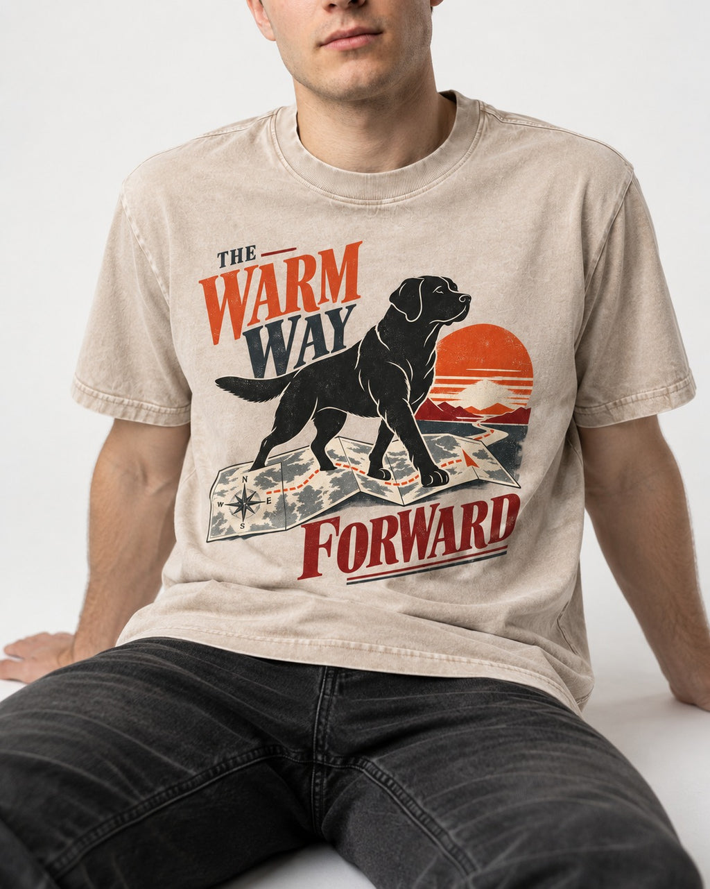 The Warm Way Forward Labrador Retriever Washed Tee in Apricot, worn by a seated model