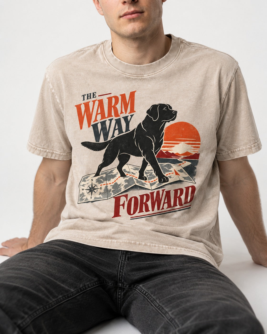 The Warm Way Forward Labrador Retriever Washed Tee in Apricot, worn by a seated model