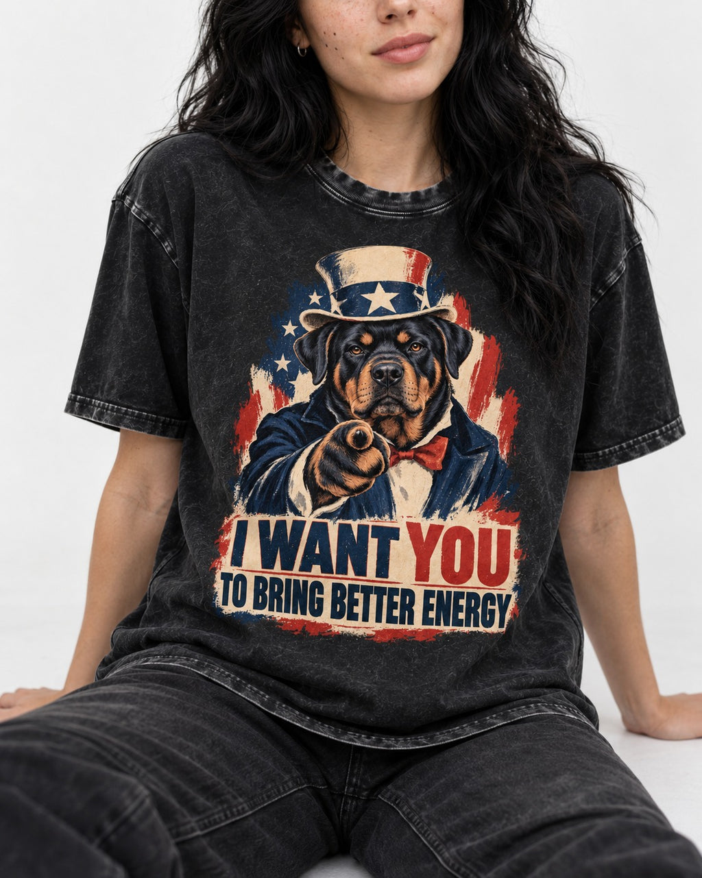 Rottweiler I Want You to Bring Better Energy Recruitment Poster Graphic Washed Tee in Black, worn by a seated model