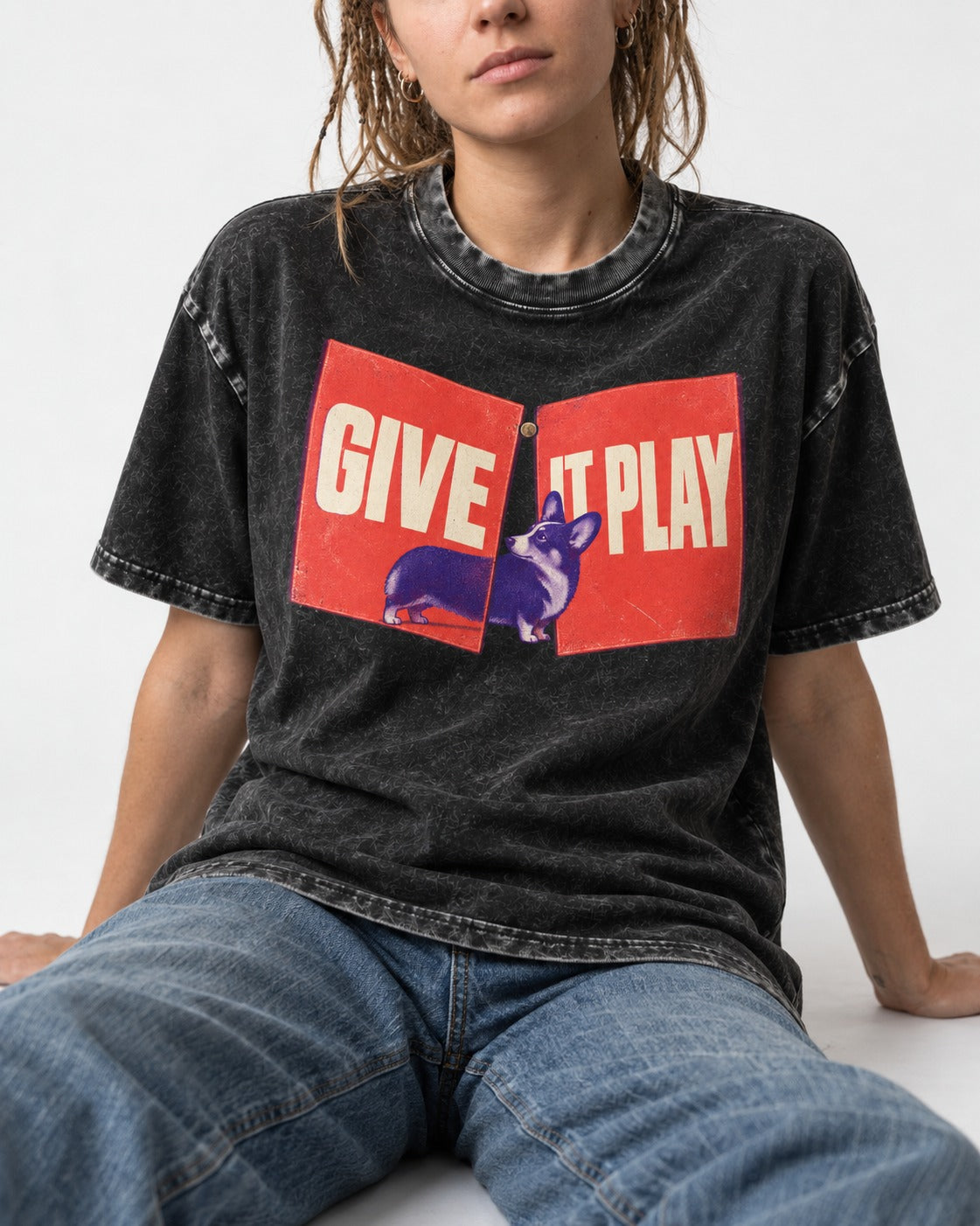 Corgi Give It Play Folding Panels Washed Tee in Black, worn by a seated model
