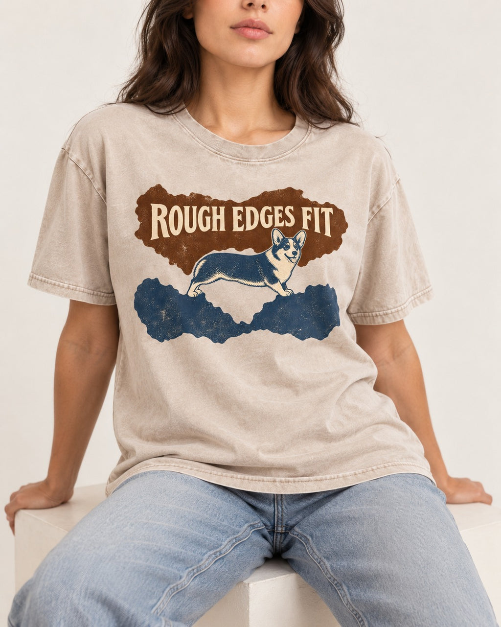 Corgi's Rough Edges Fit Washed Tee in Apricot, worn by a seated model