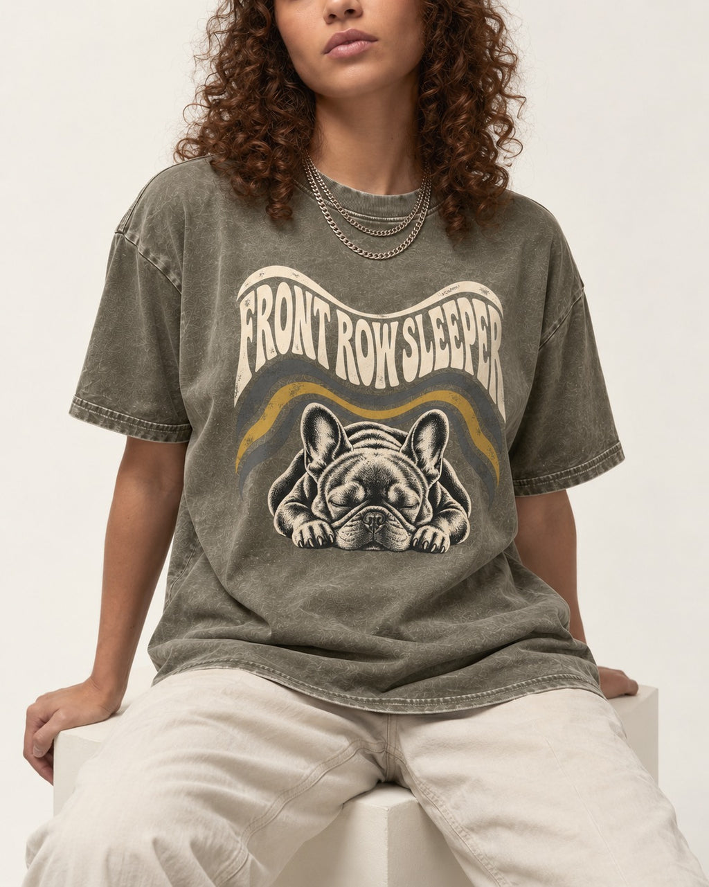 Frenchie Front Row Sleeper Retro Graphic Washed Tee in Army Green, worn by a seated model