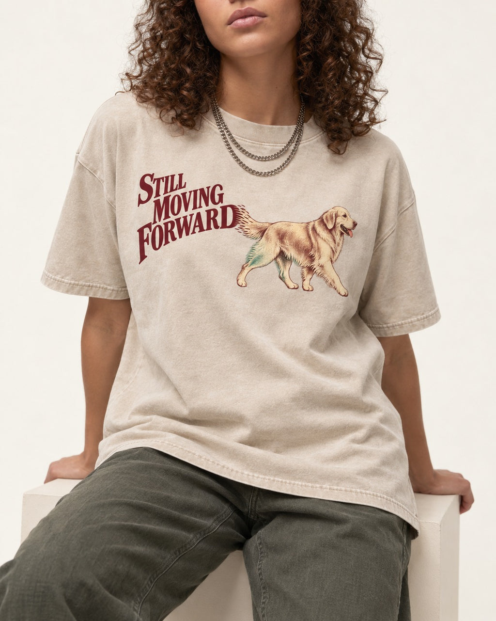 Golden Retriever Still Moving Forward Washed Tee in Apricot, worn by a seated model