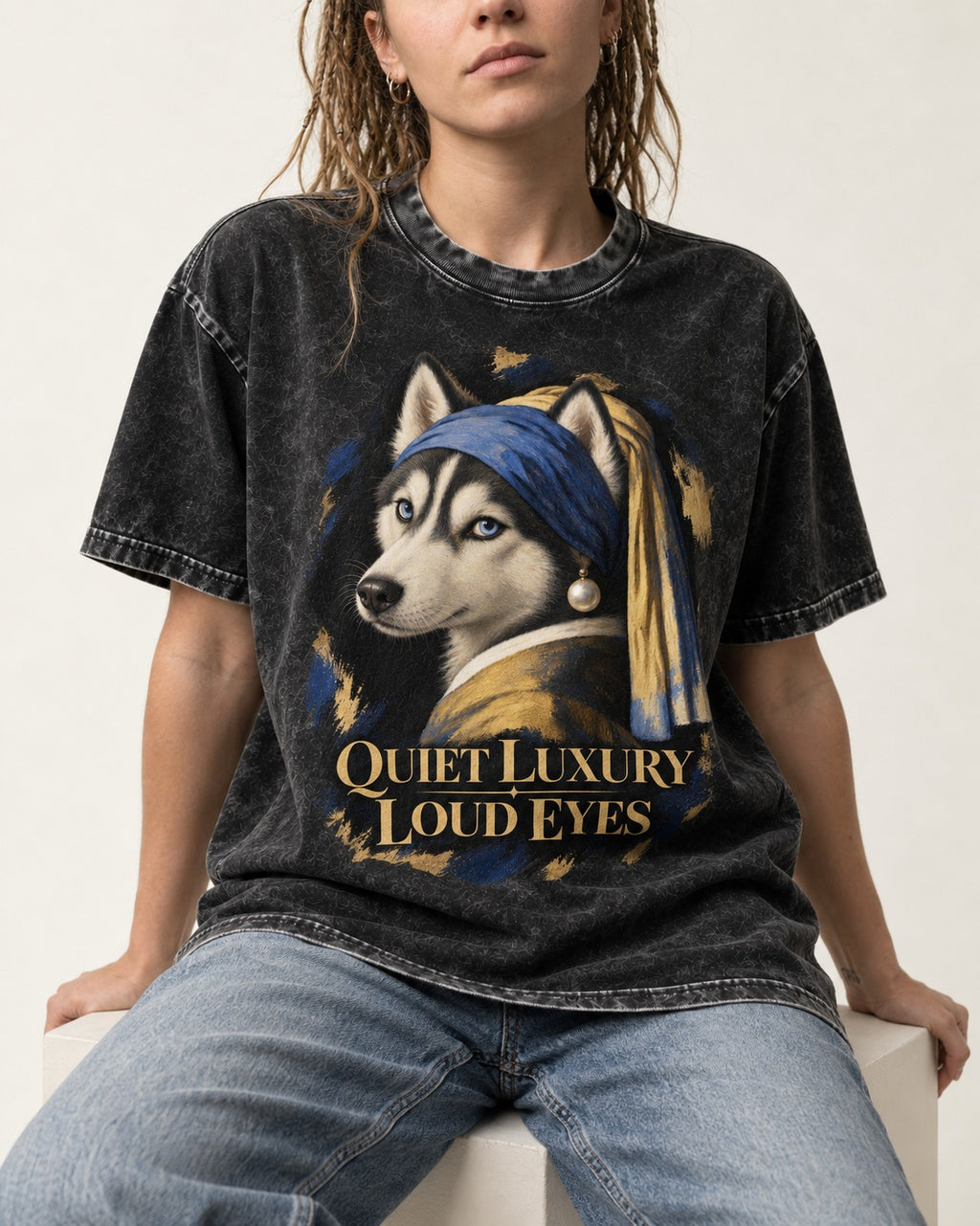 Husky Quiet Luxury Loud Eyes Pearl Portrait Graphic Washed Tee in Black, worn by a seated model