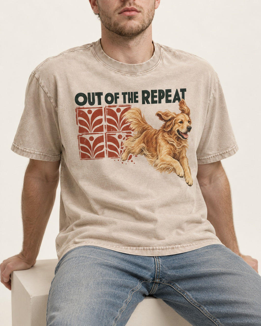 Golden Retriever Out of the Repeat Washed Tee in Apricot, worn by a seated model