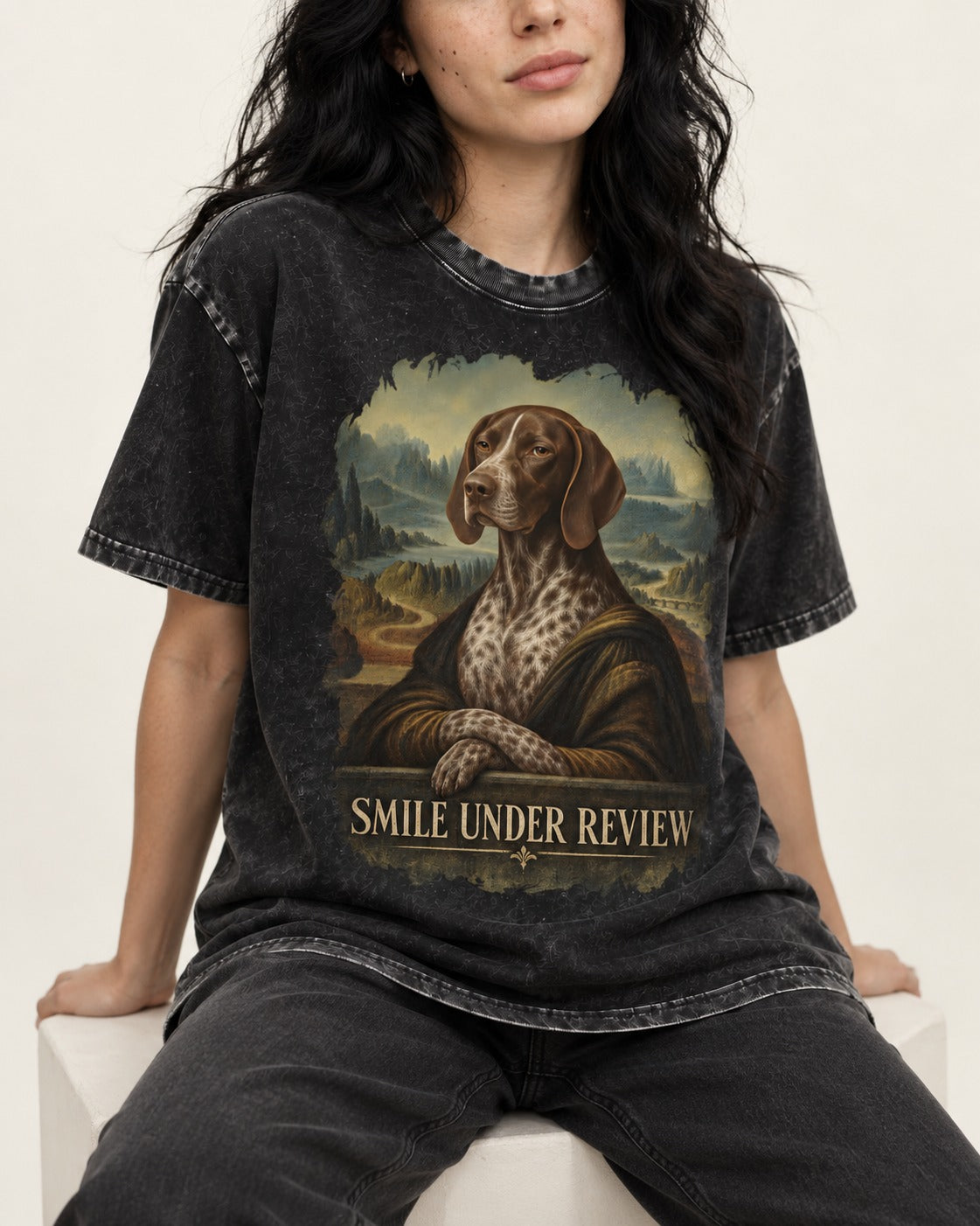 German Shorthaired Pointer Smile Under Review Renaissance Portrait Graphic Washed Tee in Black, worn by a seated model