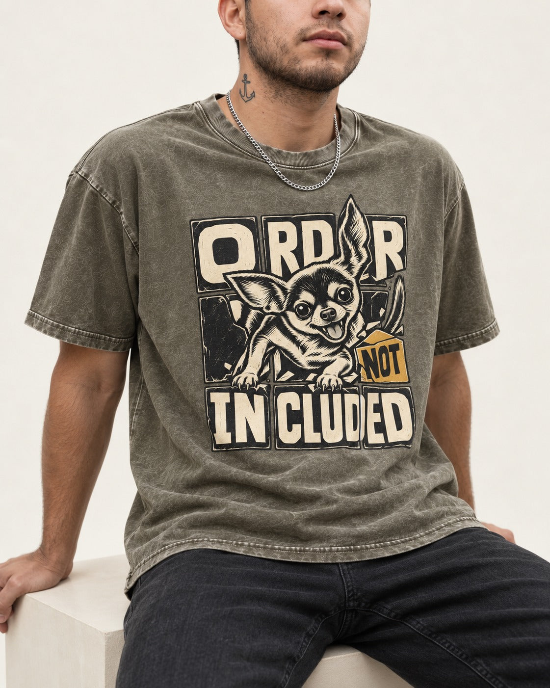 Chihuahua Order Not Included Broken Grid Graphic Washed Tee in Army Green, worn by a seated model