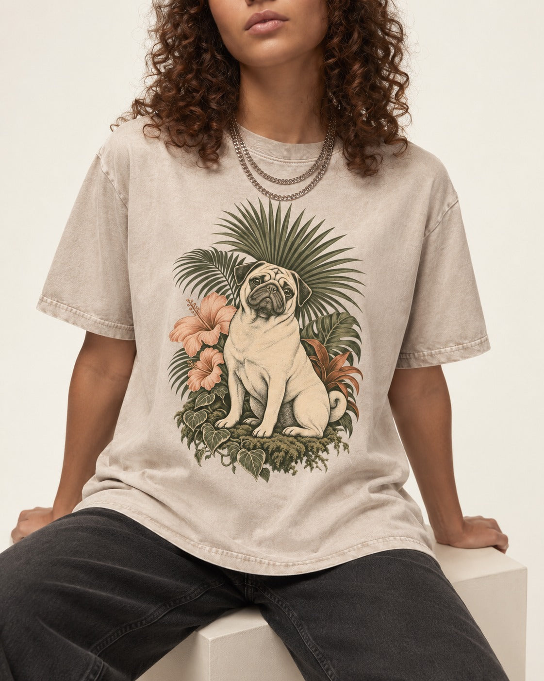 Pug Paradise Washed Tee in Apricot, worn by a seated model