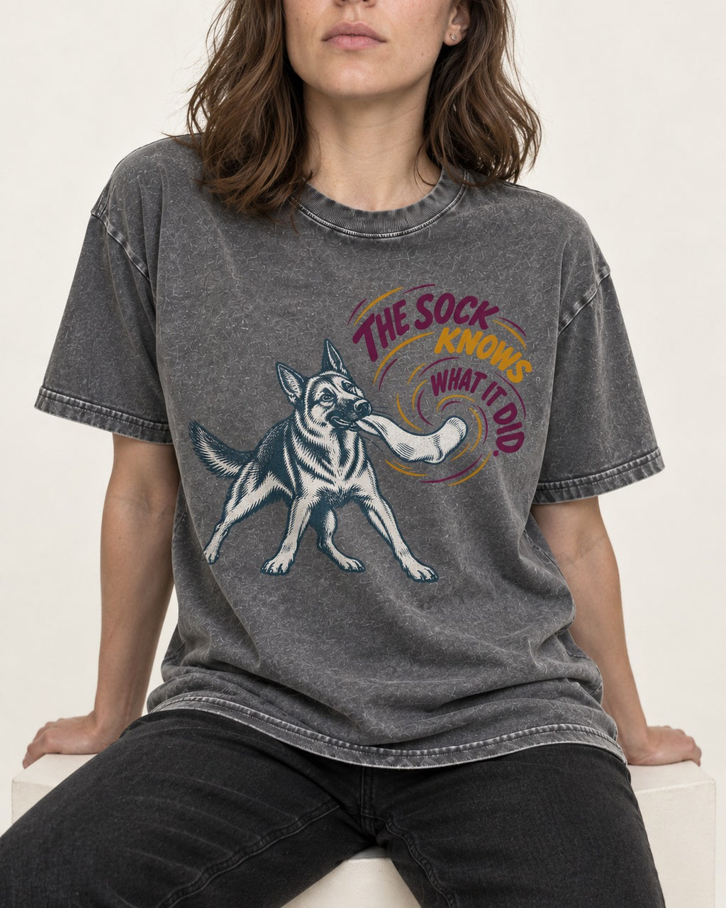 German Shepherd Dog The Sock Knows What I Did Graphic Washed Tee in Gray, worn by a seated model