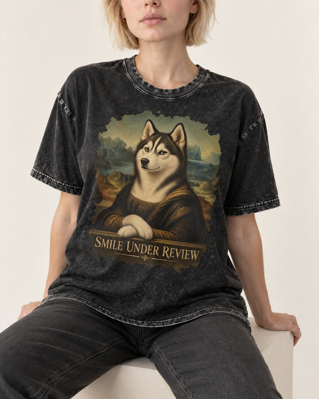 Husky Smile Under Review Renaissance Portrait Graphic Washed Tee in Black, worn by a seated model