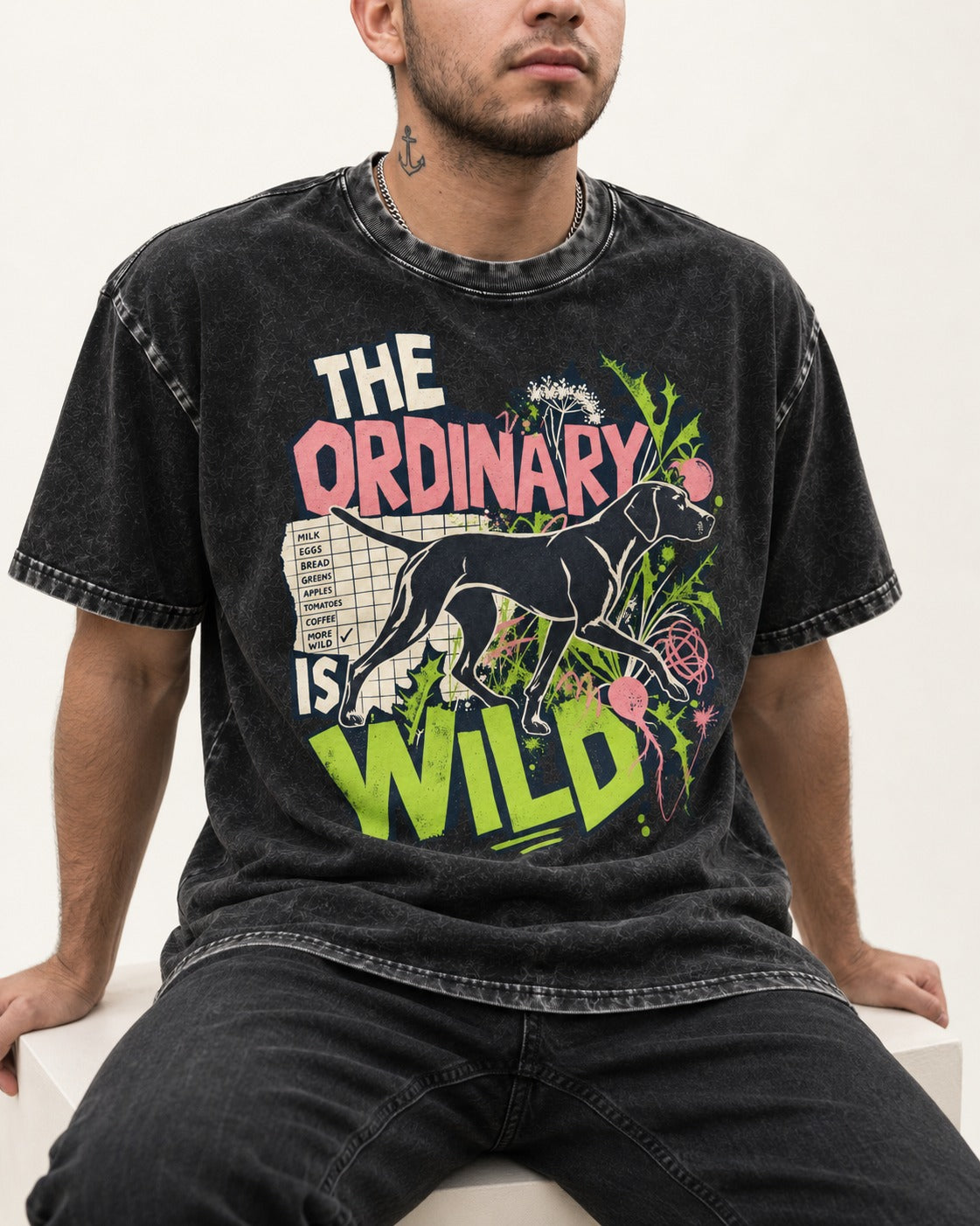German Shorthaired Pointer The Ordinary Is Wild Grocery List Graphic Washed Tee in Black, worn by a seated model