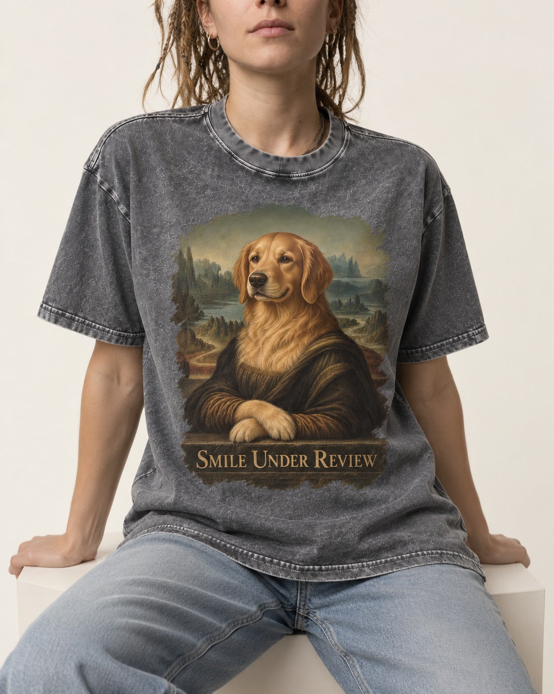 Smile Under Review Renaissance Portrait Golden Retriever Graphic Washed Tee in Gray, worn by a seated model