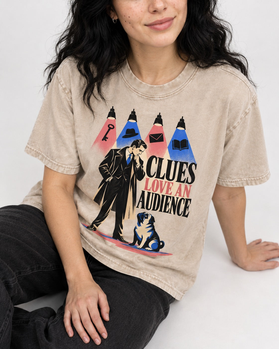 Pug Clues Love an Audience Washed Tee in Apricot, worn by a seated model