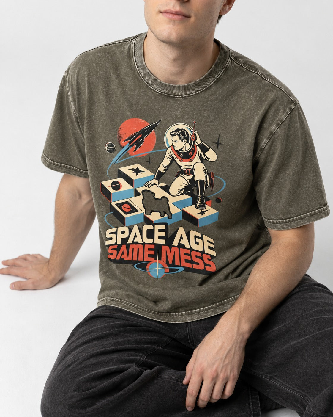 Pug Space Age Same Mess Astronaut Graphic Washed Tee in Army Green, worn by a seated model