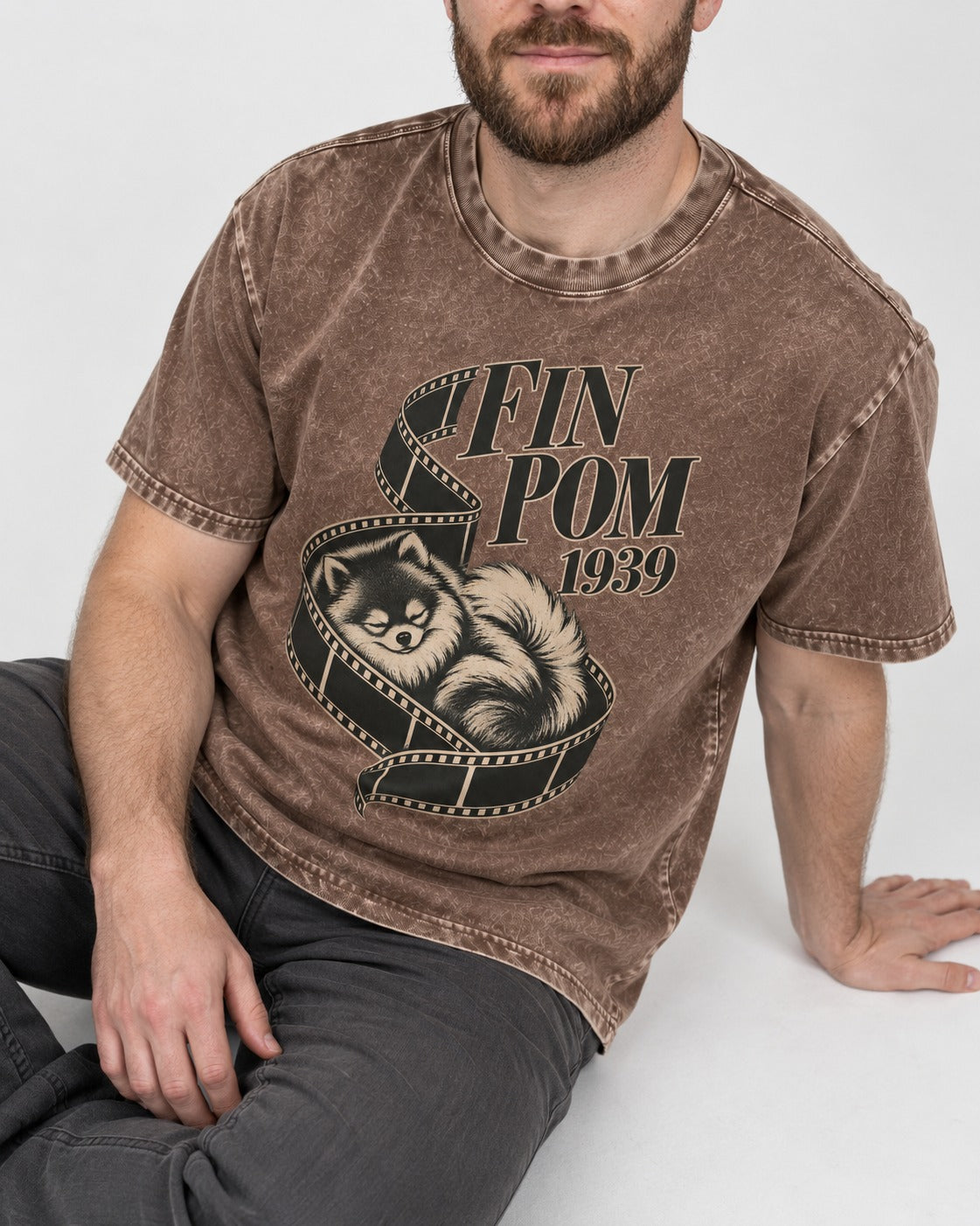 Fin Pomeranian Washed Tee in Coffee, worn by a seated model