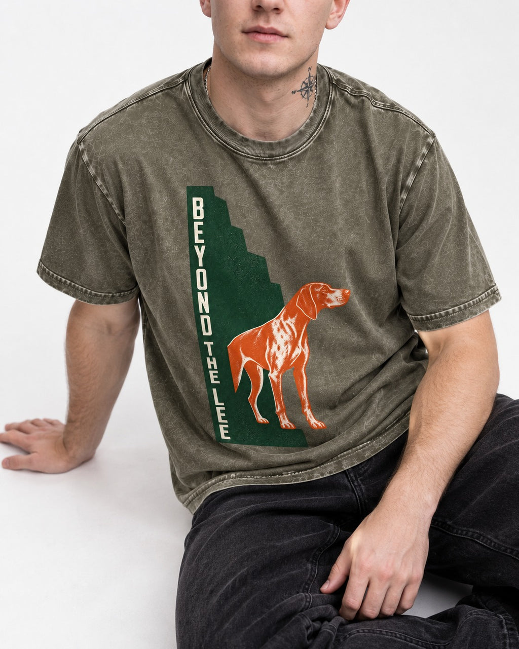 German Shorthaired Pointer Beyond the Lee Monument Graphic Washed Tee in Army Green, worn by a seated model