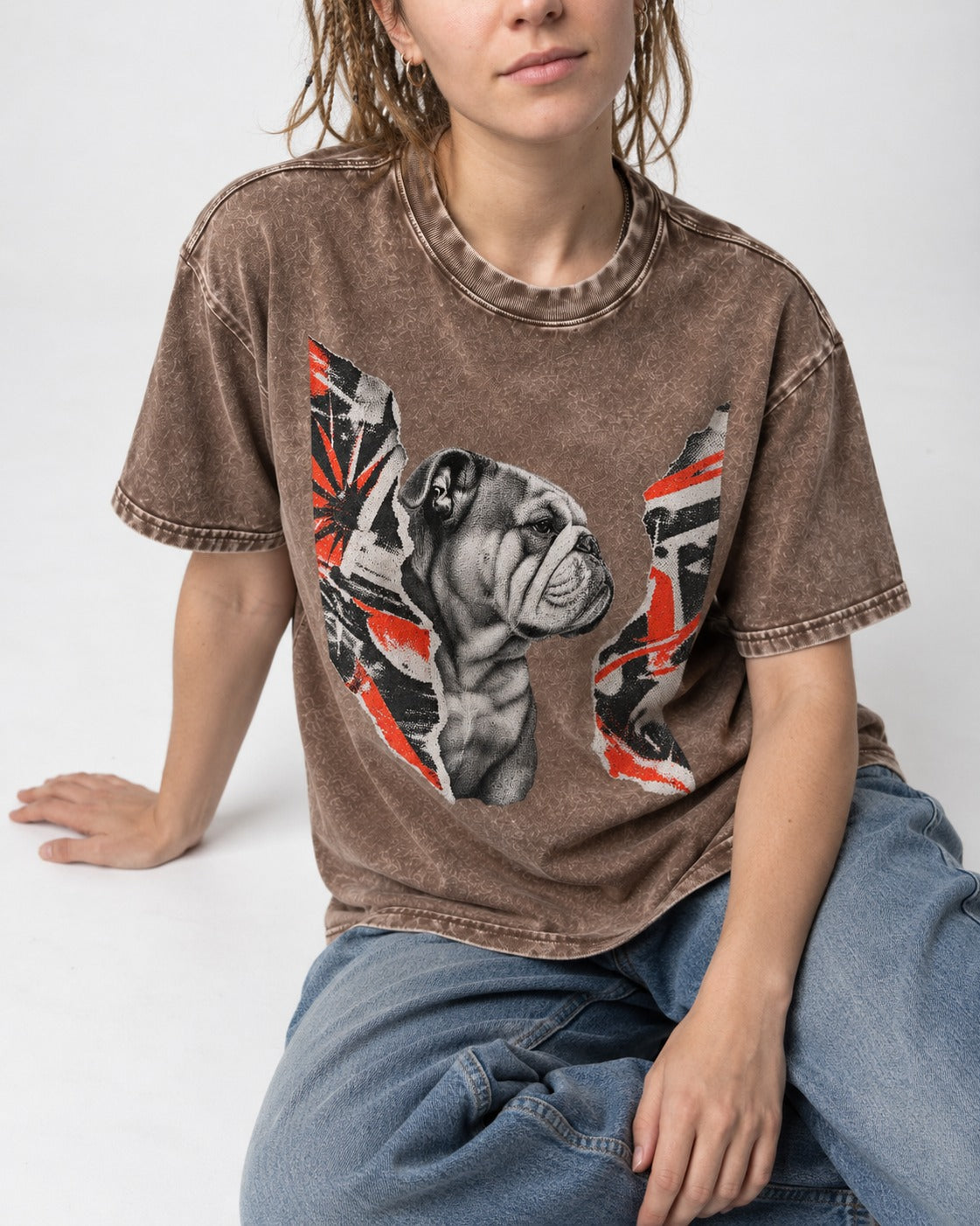 English Bulldog Unbowed Washed Tee in Coffee, worn by a seated model