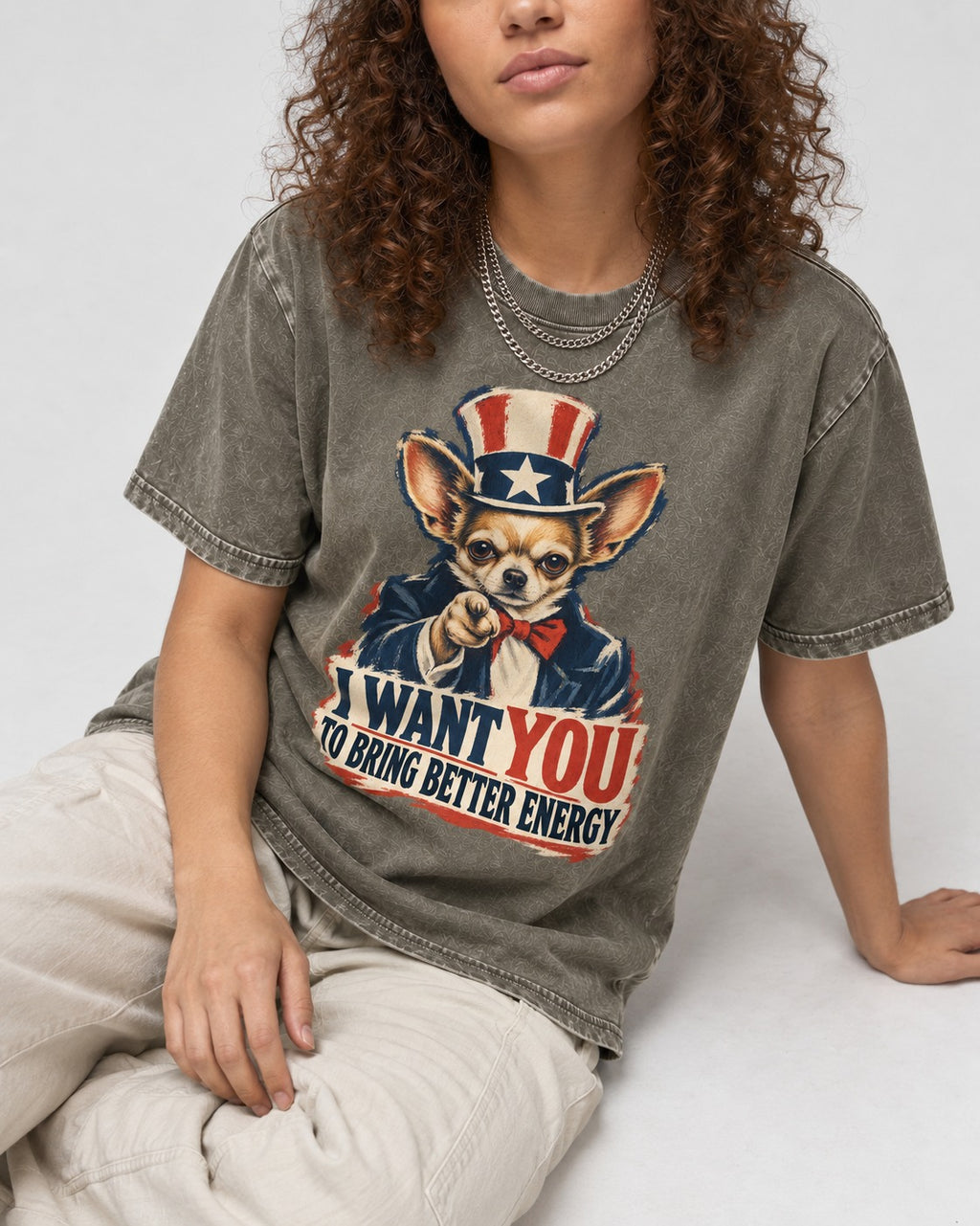 Chihuahua I Want You to Bring Better Energy Uncle Sam Graphic Washed Tee in Army Green, worn by a seated model