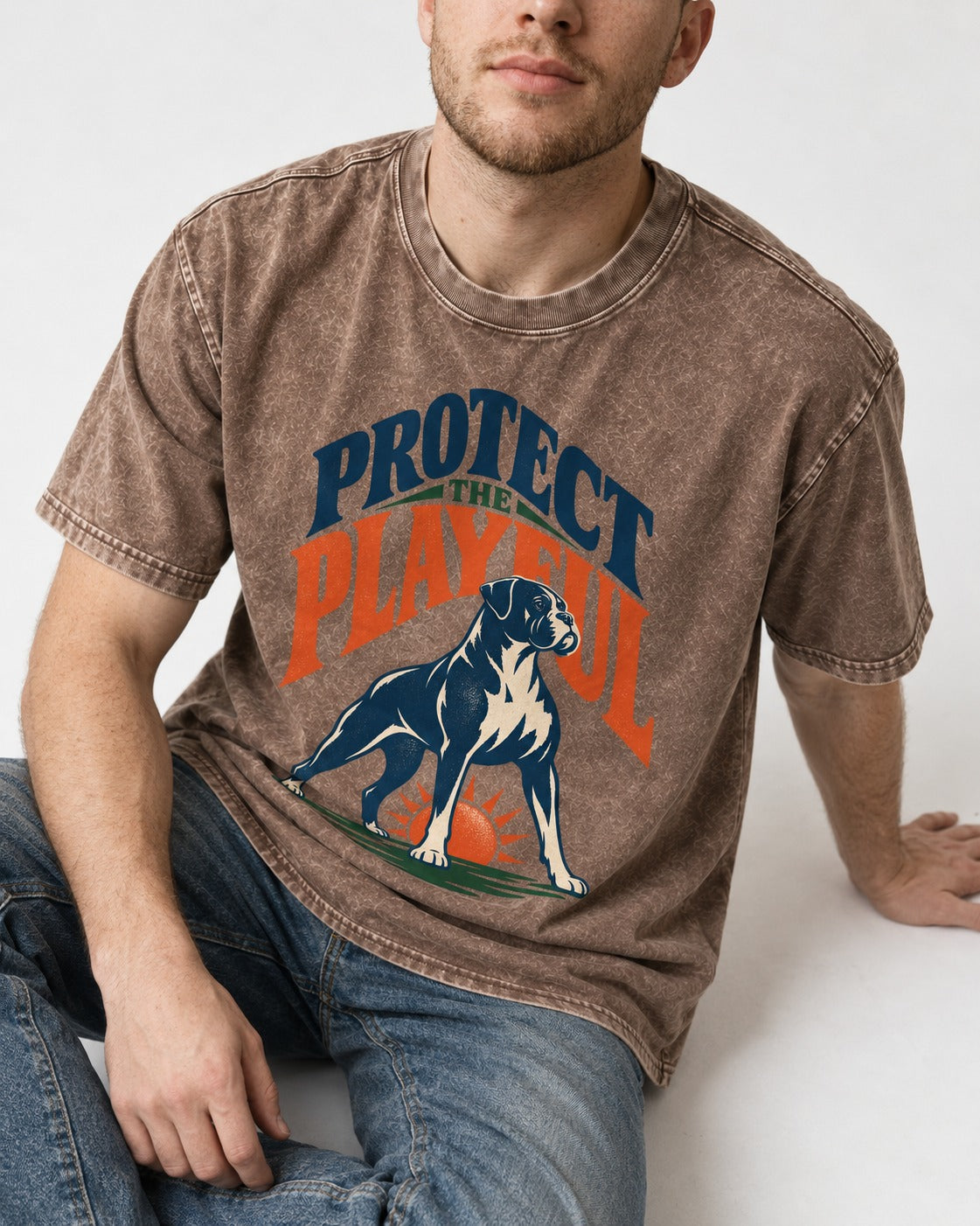Protect the Playful Boxer Washed Tee in Coffee, worn by a seated model