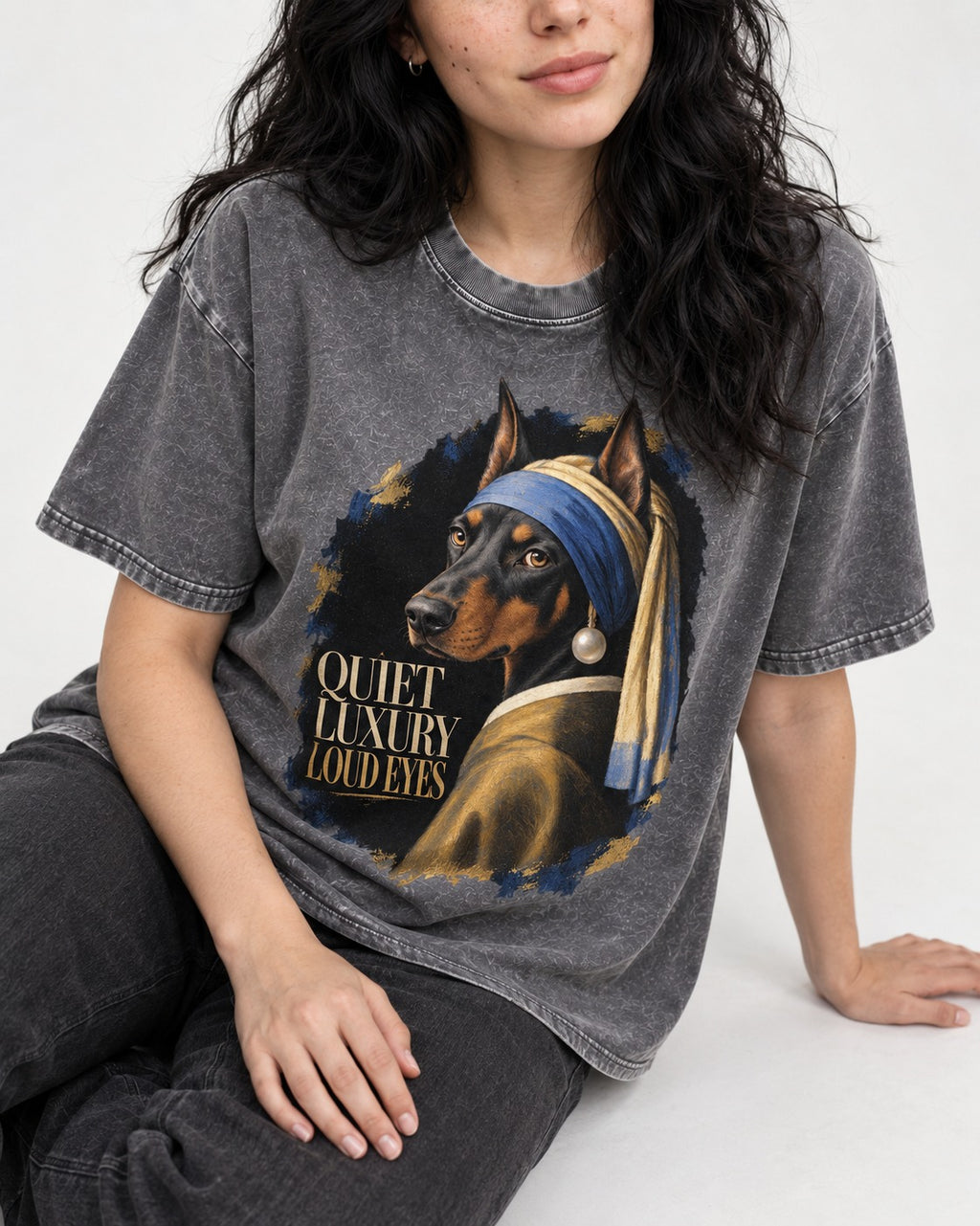 Doberman Quiet Luxury Loud Eyes Pearl Portrait Graphic Washed Tee in Gray, worn by a seated model