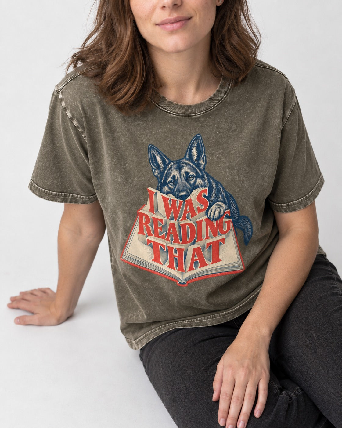 German Shepherd Dog I Was Reading That Open Book Graphic Washed Tee in Army Green, worn by a seated model