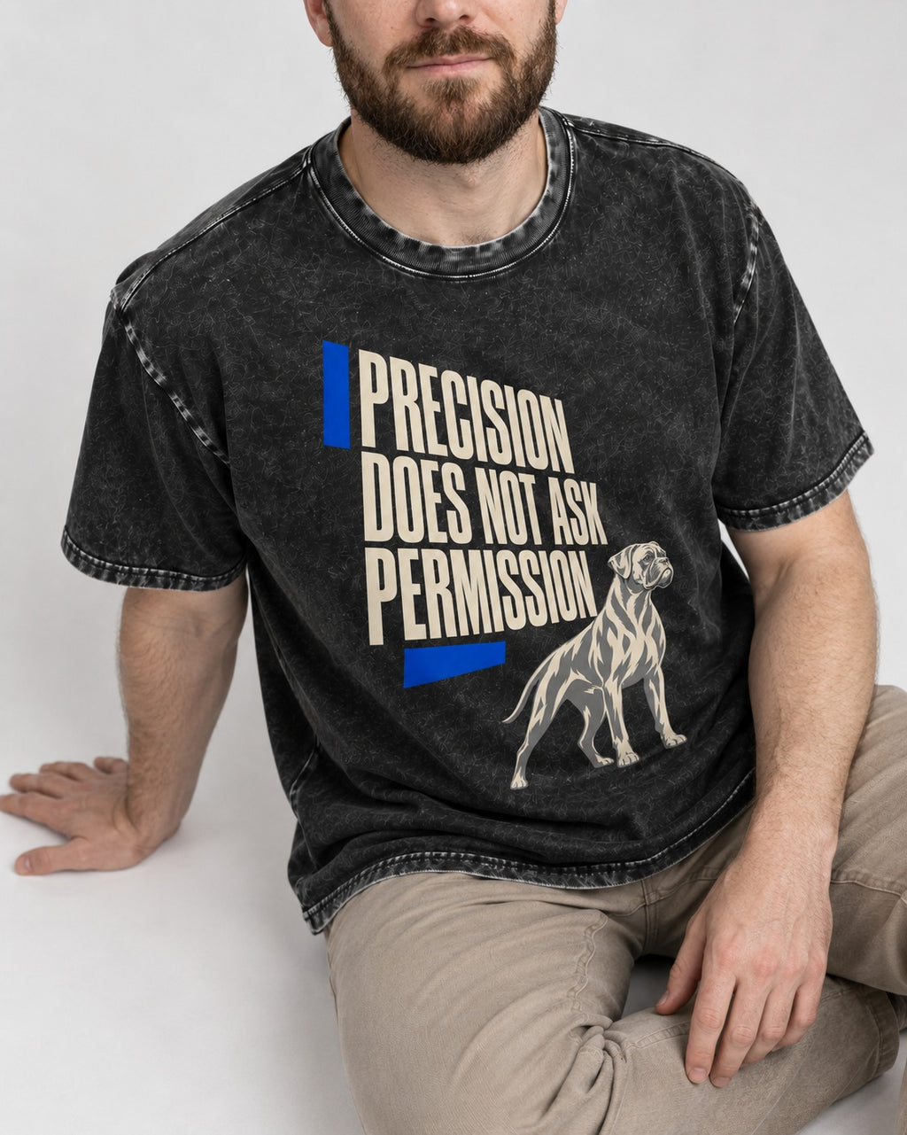 Precision Does Not Ask Permission Boxer Washed Tee in Black, worn by a seated model