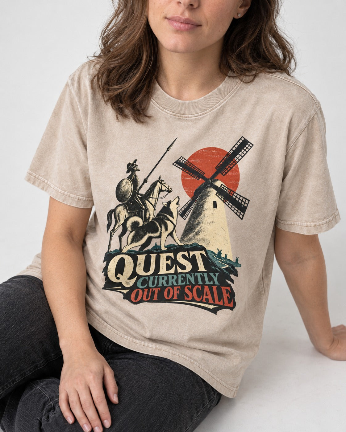 Husky Quest Out of Scale Washed Tee in Apricot, worn by a seated model