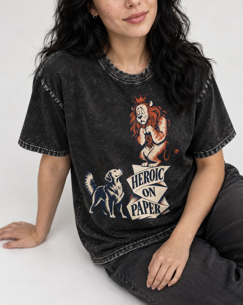 Golden Retriever Heroic on Paper Lion Graphic Washed Tee in Black, worn by a seated model