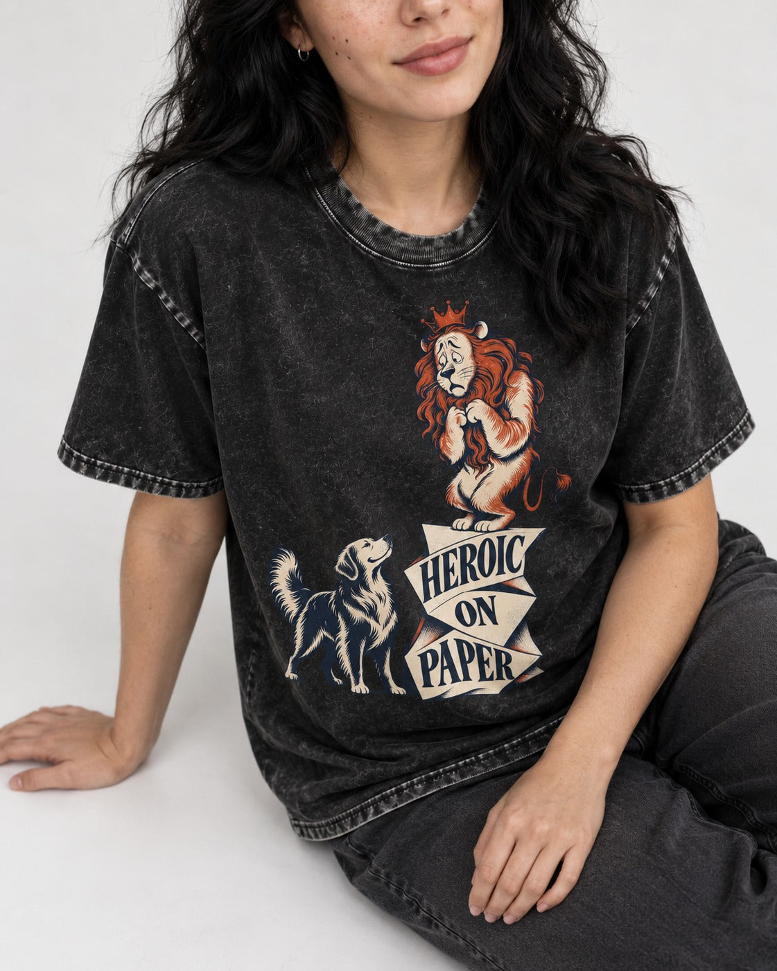 Golden Retriever Heroic on Paper Lion Graphic Washed Tee in Black, worn by a seated model