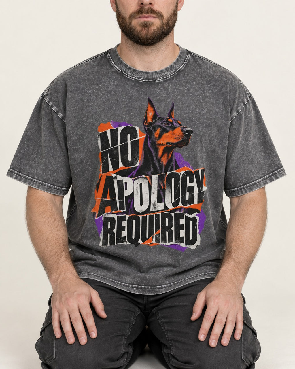 Doberman No Apology Required Torn Paper Graphic Washed Tee in Gray, worn by a seated model