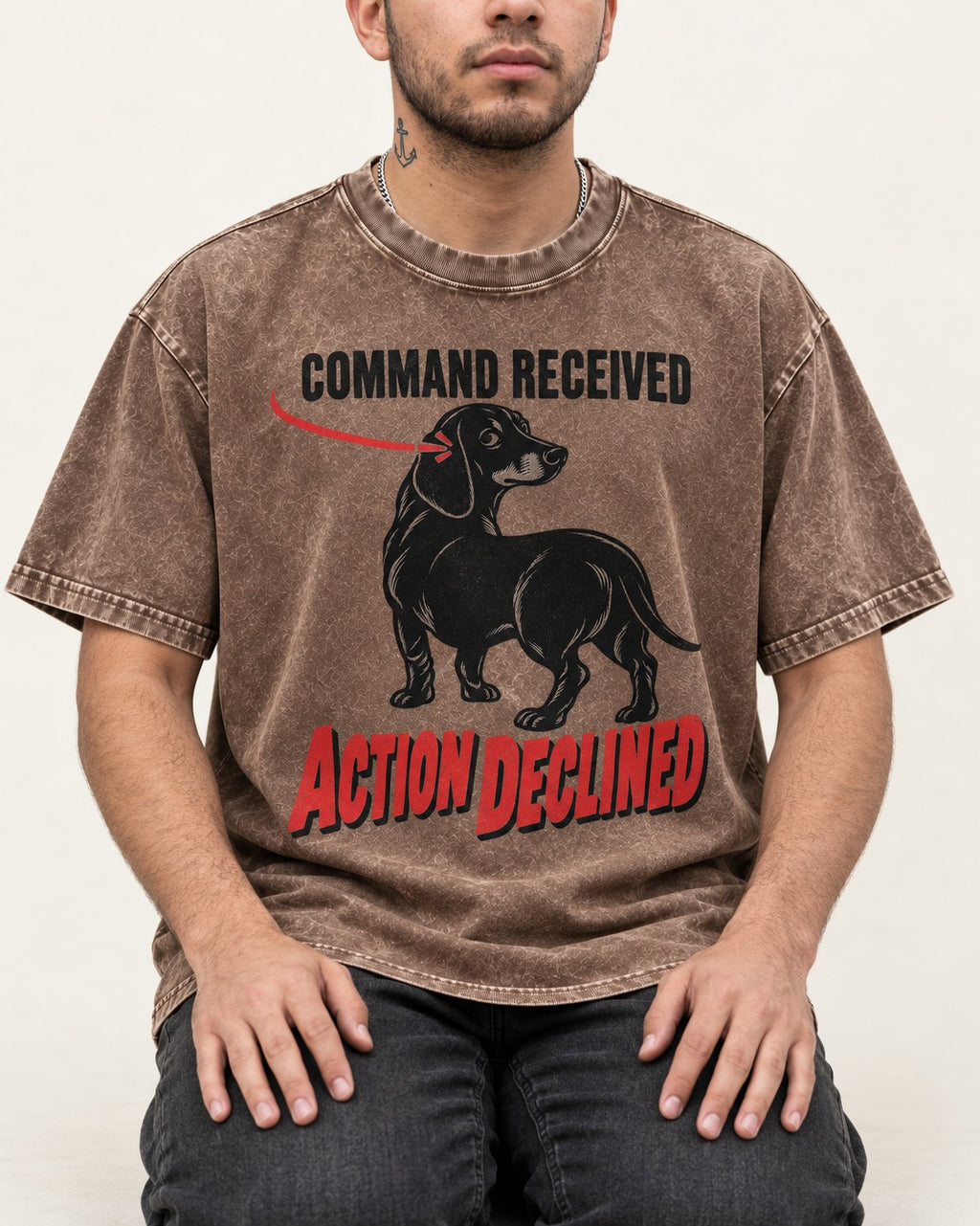 Dachshund Action Declined Washed Tee in Coffee, worn by a seated model