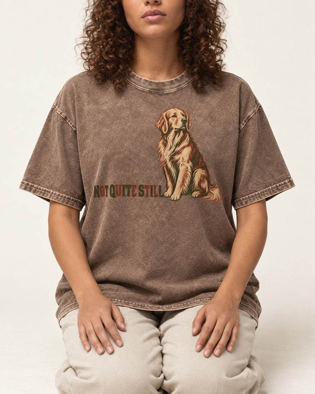 Golden Retriever Not Quite Still Washed Tee in Coffee, worn by a seated model