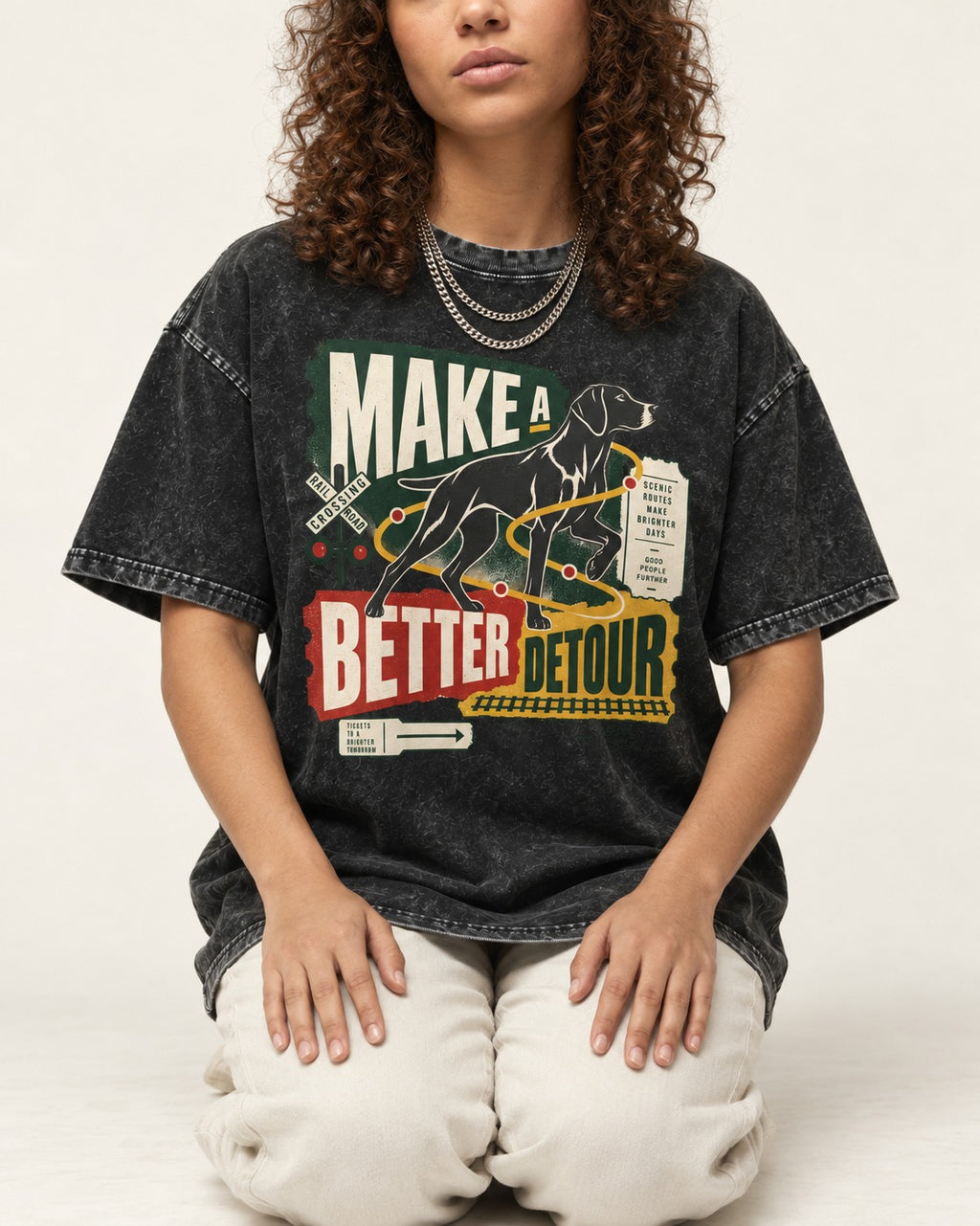 German Shorthaired Pointer Make a Better Detour Railroad Graphic Washed Tee in Black, worn by a seated model