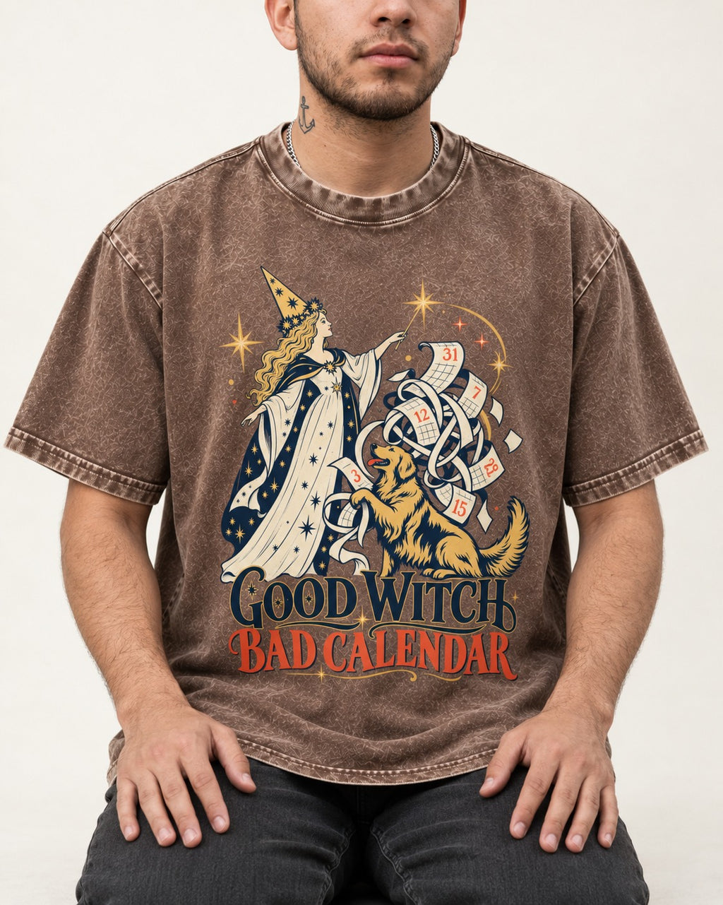 Good Witch Bad Calendar Golden Retriever Washed Tee in Coffee, worn by a seated model