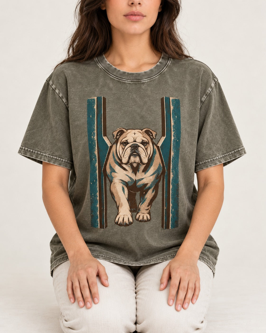 English Bulldog Walking Through Teal Gate Graphic Washed Tee in Army Green, worn by a seated model