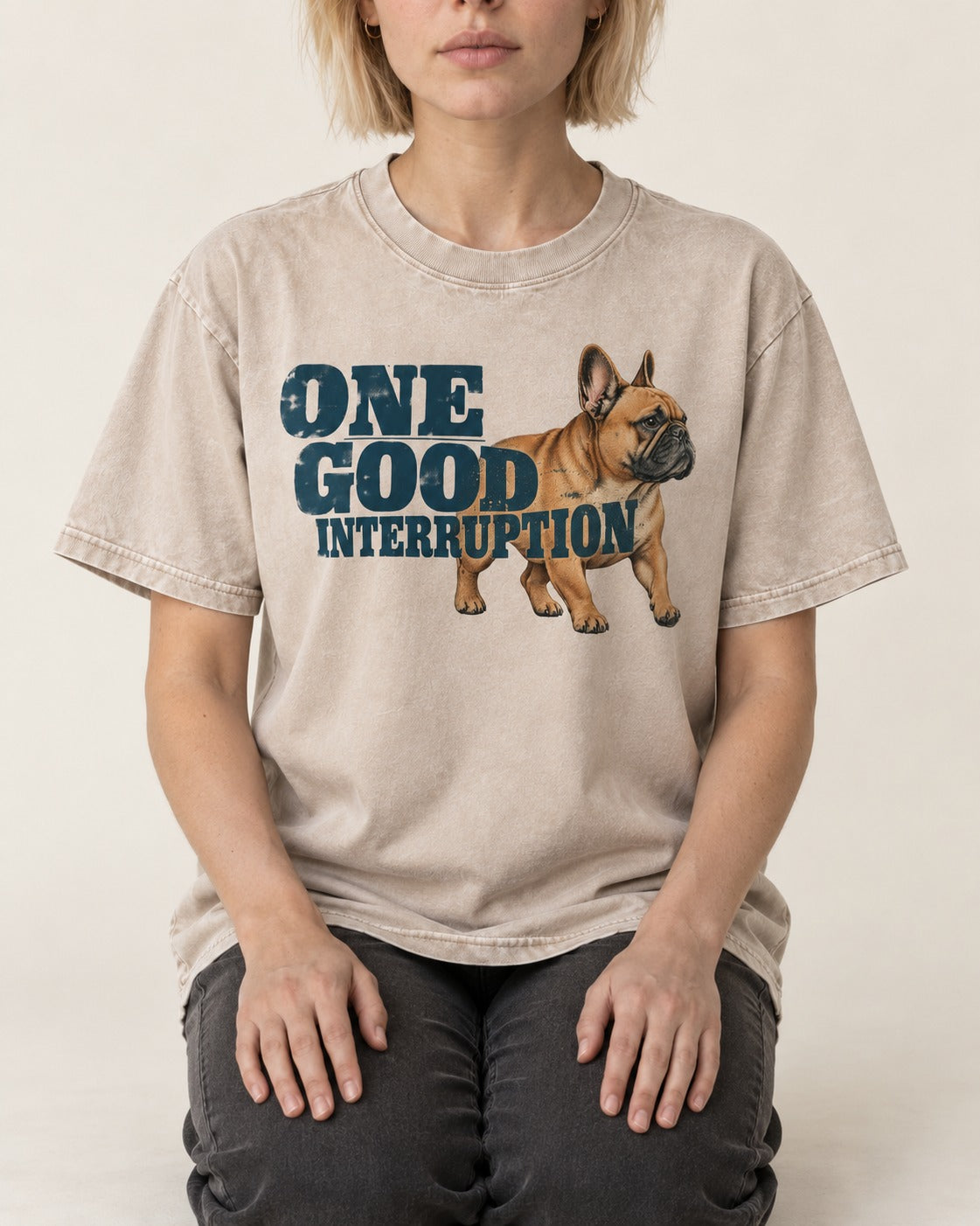 One Good Frenchie Interruption Washed Tee in Apricot, worn by a seated model