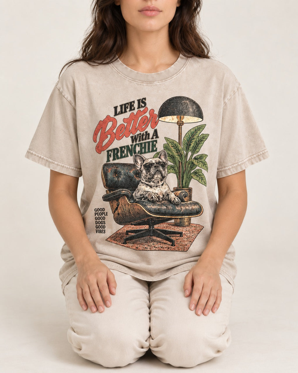 Better with a Frenchie Washed Tee in Apricot, worn by a seated model