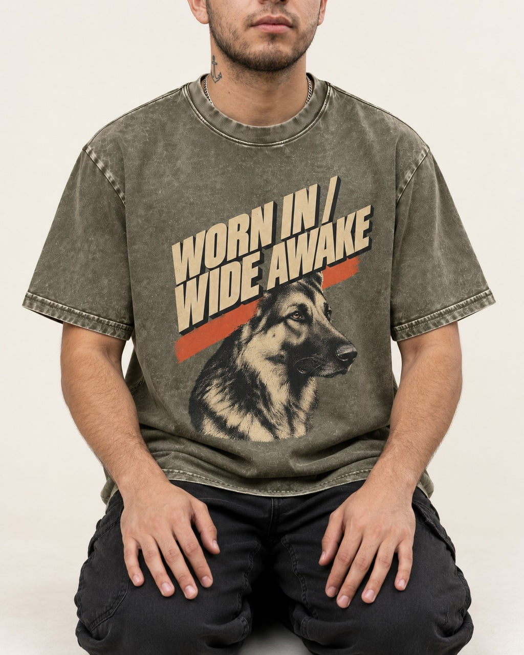 Worn In Wide Awake Portrait German Shepherd Dog Graphic Washed Tee in Army Green, worn by a seated model