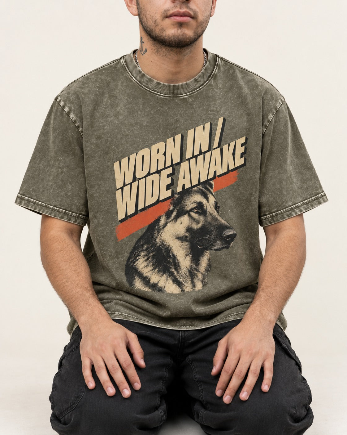 Worn In Wide Awake Portrait German Shepherd Dog Graphic Washed Tee in Army Green, worn by a seated model