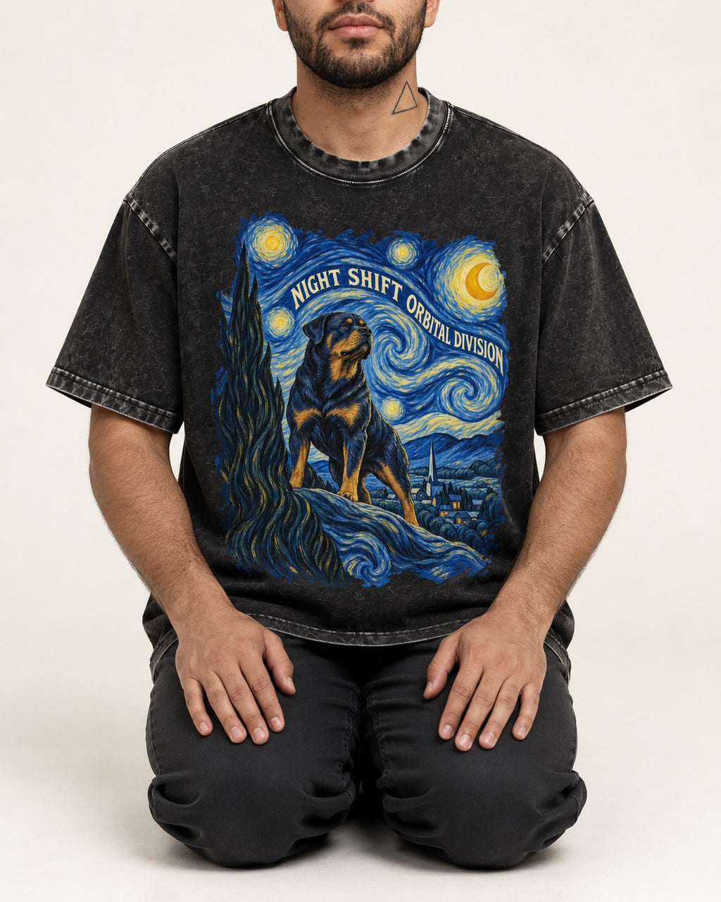 Rottweiler Night Shift Orbital Division Starry Night Graphic Washed Tee in Black, worn by a seated model