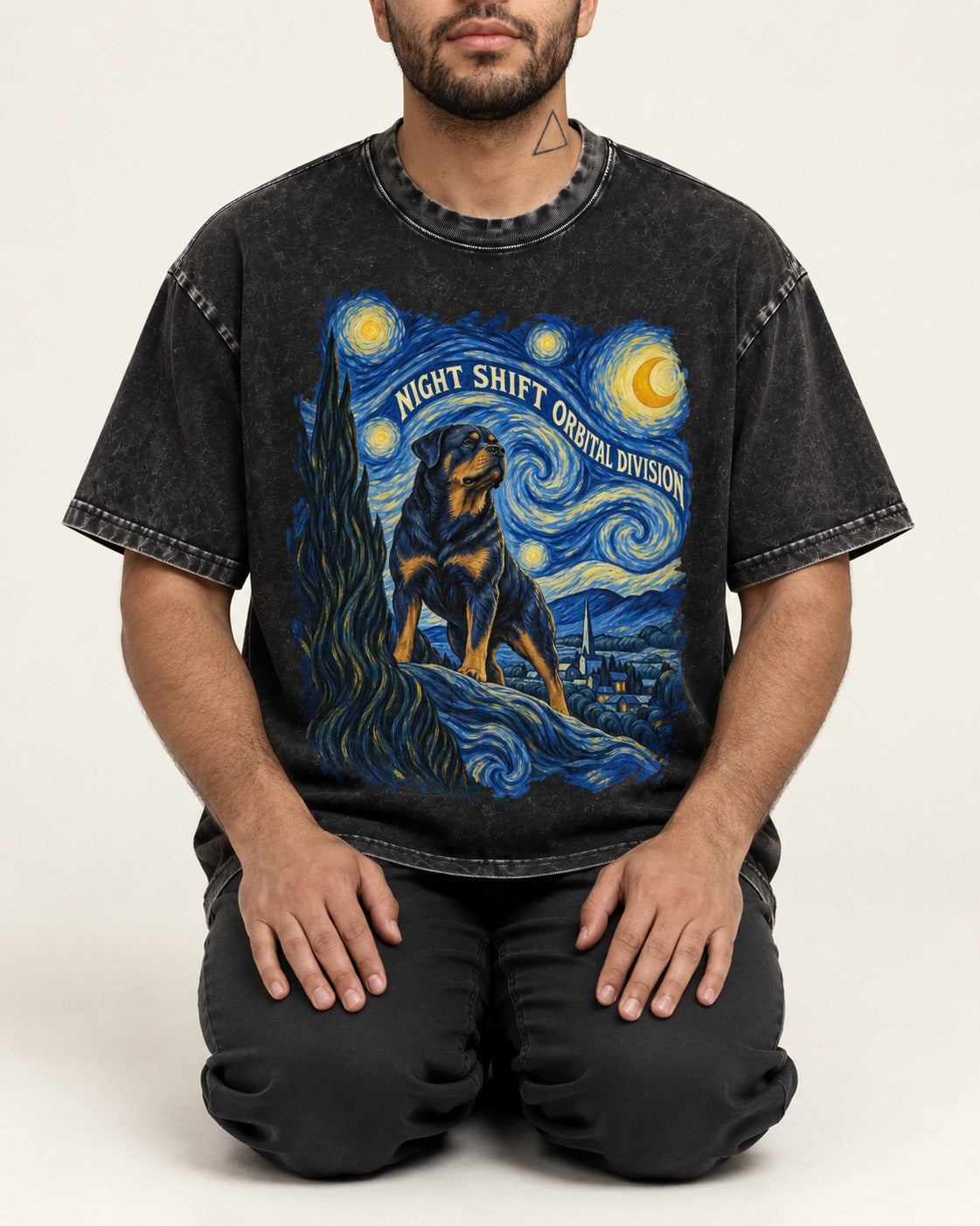 Rottweiler Night Shift Orbital Division Starry Night Graphic Washed Tee in Black, worn by a seated model